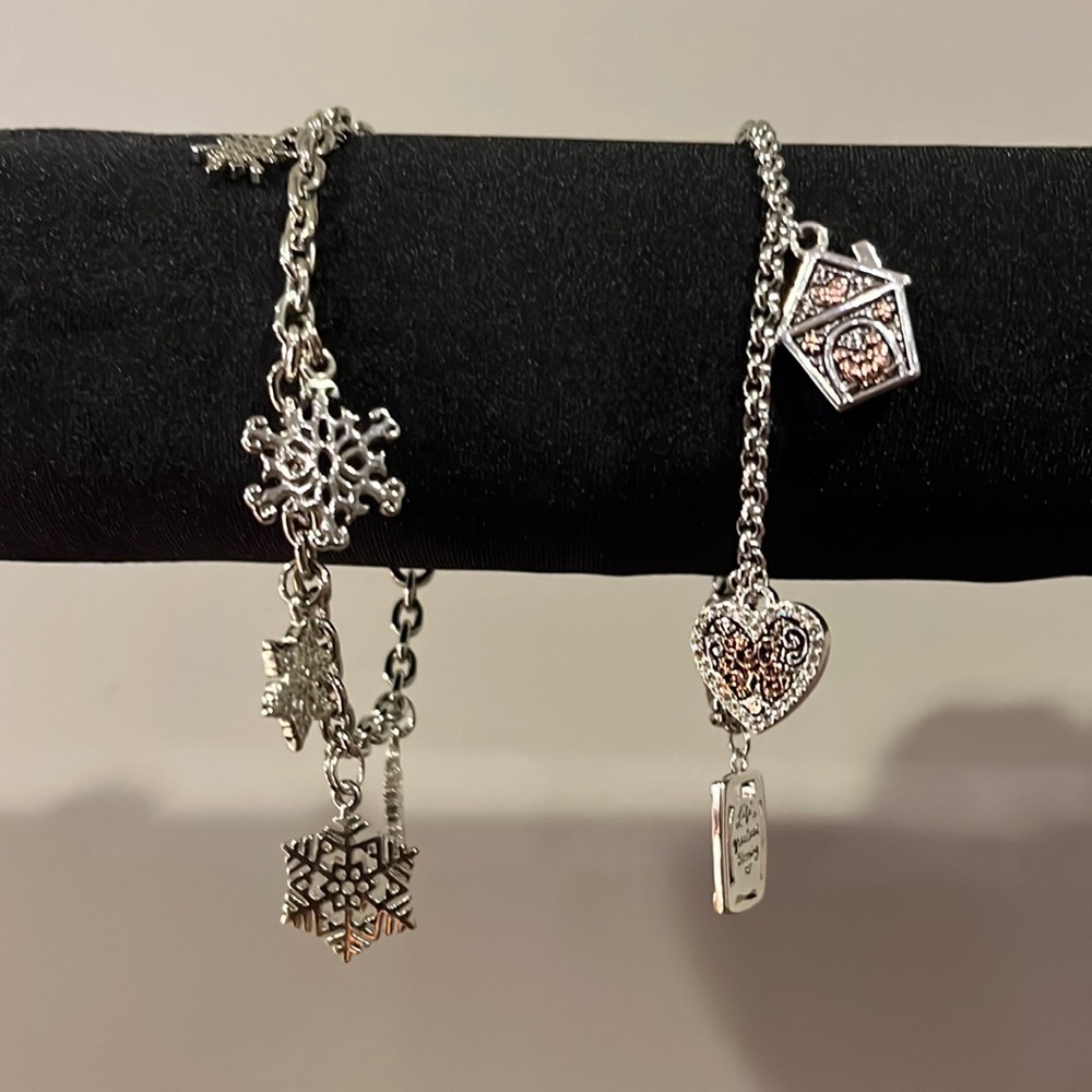 2 silvertone charm bracelets. Snowflakes bracelet and Family love bracelet.